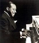 Бейси Каунт (за роялем)